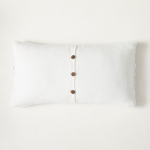 white macrame pillow