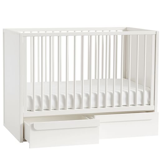 white cot with storage