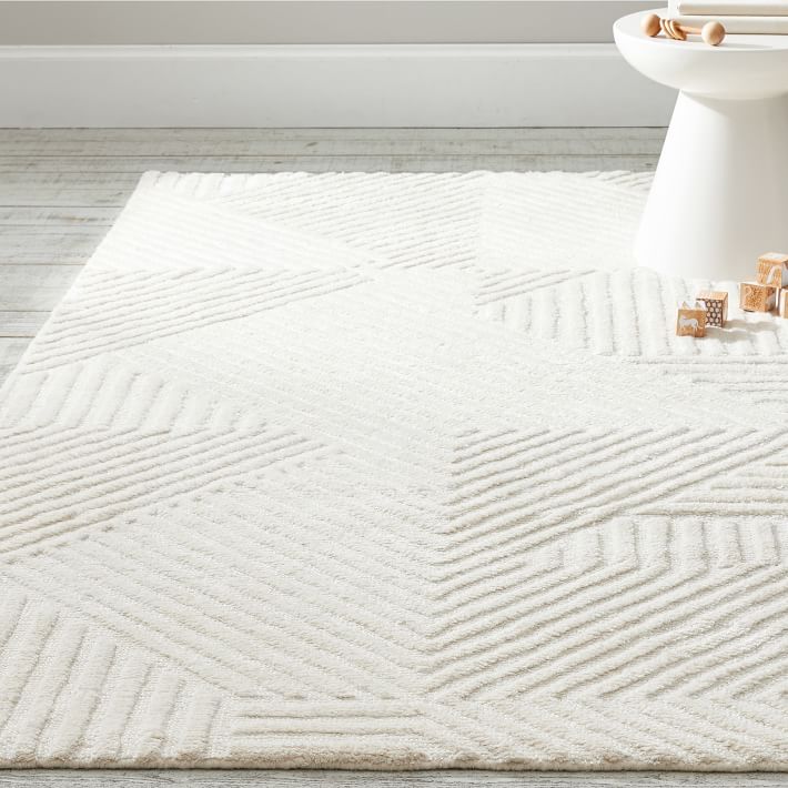 A soft white rug with lines pattern