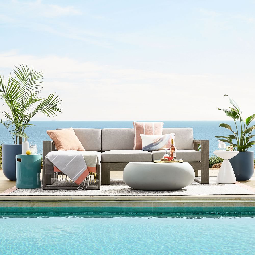 Pebble Indoor/Outdoor Oval Coffee Table (36") West Elm