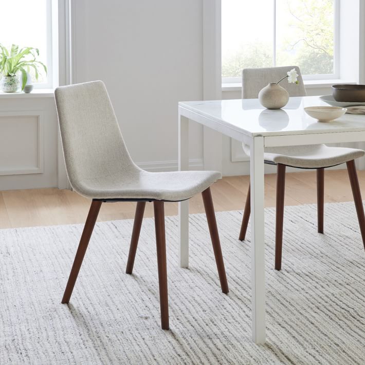 white dining chair with wooden legs