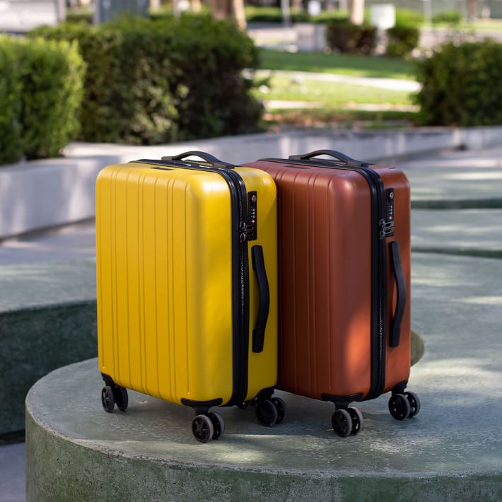 yellow rolling luggage