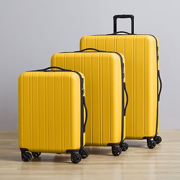 yellow rolling luggage