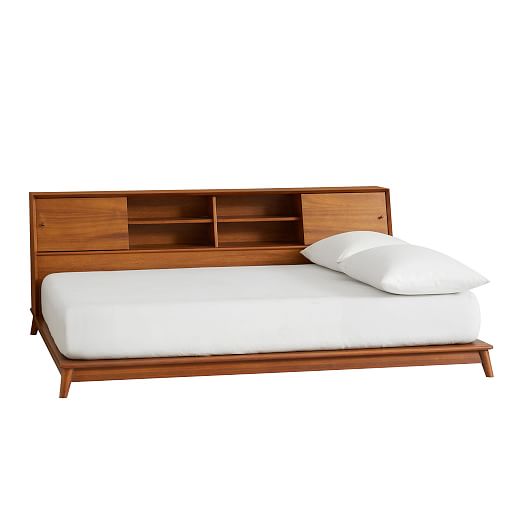 bed with shelf on side