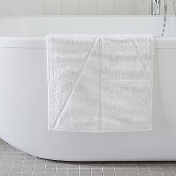 https://assets.weimgs.com/weimgs/rk/images/wcm/products/202332/0015/triangle-sculpted-bath-mat-m.jpg