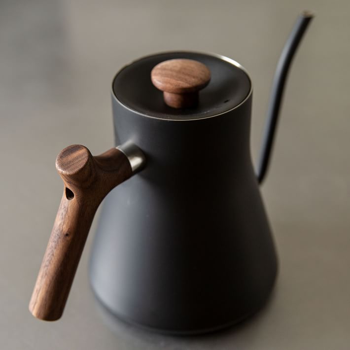 https://assets.weimgs.com/weimgs/rk/images/wcm/products/202342/0005/fellow-stagg-electric-kettle-matte-black-w-walnut-handle-o.jpg