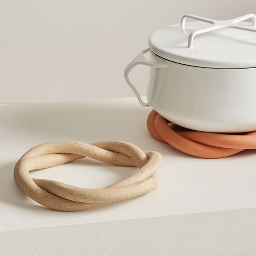 https://assets.weimgs.com/weimgs/rk/images/wcm/products/202342/0017/sin-ceramic-twist-trivet-c.jpg