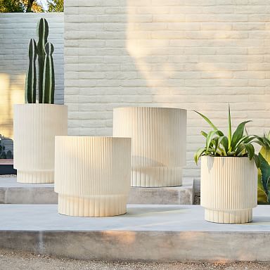 https://assets.weimgs.com/weimgs/rk/images/wcm/products/202347/0008/fluted-ficonstone-indoor-outdoor-planters-q.jpg