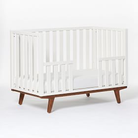 White crib with store wood legs