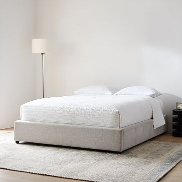 Low shop upholstered bed