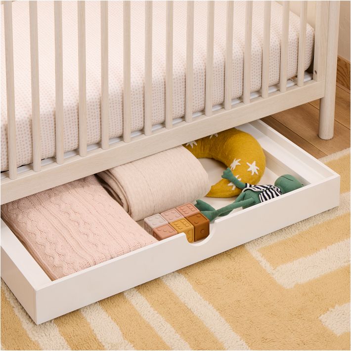 Under-crib storage bins on wheels