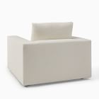 Rear/side view of armchair showing back and base with fabric upholstery