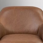 Close-up of the leather seat and upper chest area of the chair.