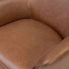 Top view of a brown leather chair seat showing soft, smooth leather surface.
