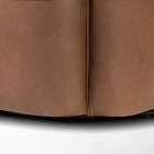 Bottom front edge of the chair showing the curved base and seam where the upholstery meets.