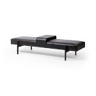 A black leather-like long daybed with metal legs, minimalist design