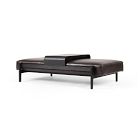 A dark brown leather-like long daybed with metal legs, similar style to previous images