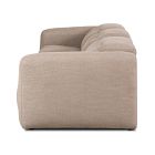 Close-up of beige fabric sofa armrest and back cushion viewed from above.