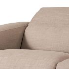 Close-up of beige fabric upholstery on sofa cushion.