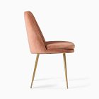 Peach/rose-terracotta upholstered chair with wooden legs.