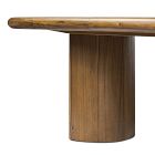 Rounded wooden leg and apron of the table