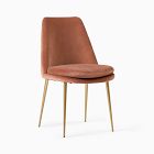 Orange/terracotta upholstered chair with wooden legs.
