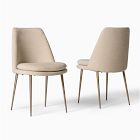 Two beige two-tone chairs facing each other, showing the back and seat.