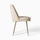 Beige upholstered chair shown in profile with wooden legs.