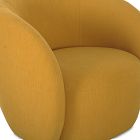 Close-up of mustard-yellow cushion and curved arm of a lounge chair.