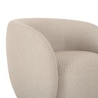 Close-up of beige curved arm and backrest of a lounge chair.