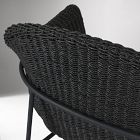 Close-up of woven wicker material on chair showing texture