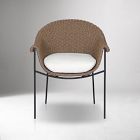Beige woven wicker chair with white cushion, front view