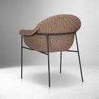 Beige woven wicker chair from back/right side