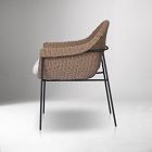 Beige woven wicker chair with side view and metal legs