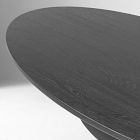 Long curved dark wooden tabletop with visible grain