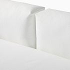 Close-up of white sofa back cushions with seam lines