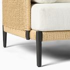 Close-up of the woven rattan frame leg of outdoor furniture