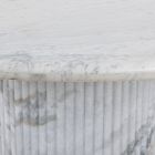 Marble edge and vertical grooves on pedestal