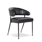 Close-up of black leather channeled back of dining chair
