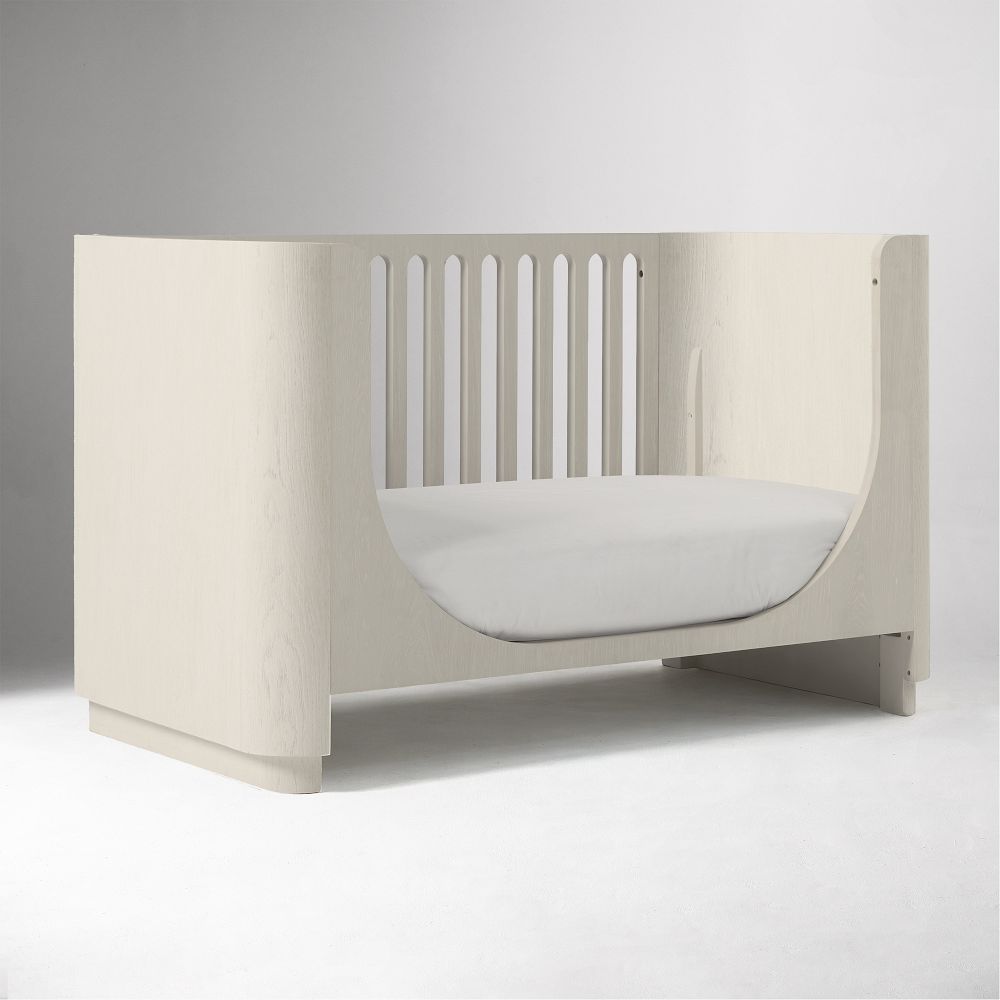 White crib conversion kit component viewed from front