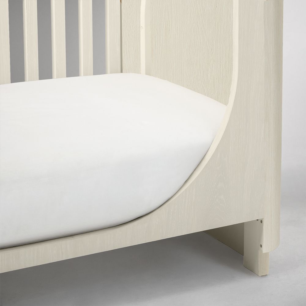 Bottom corner and leg of crib conversion kit with panel joint