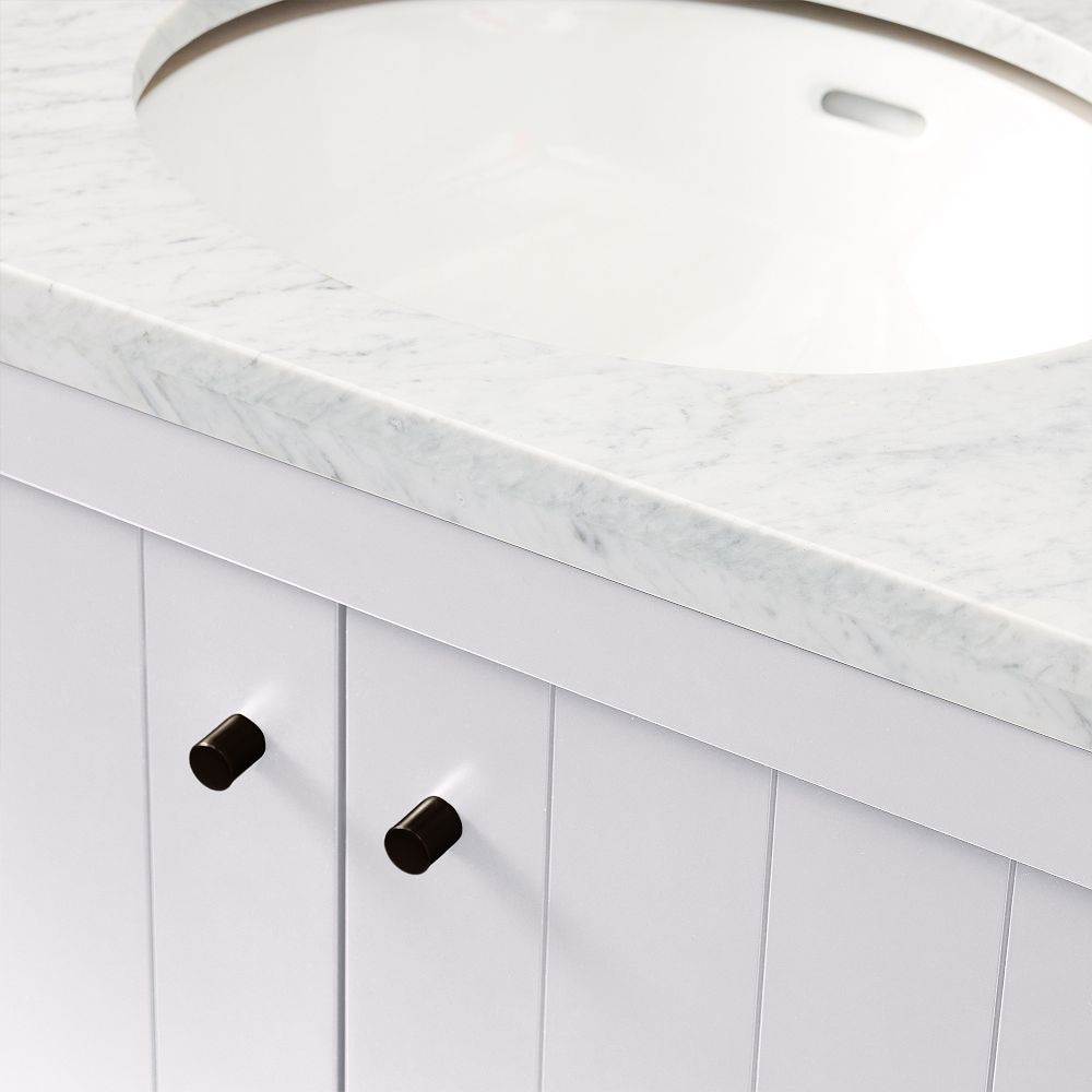 Close-up of cabinet knobs and vertical paneling