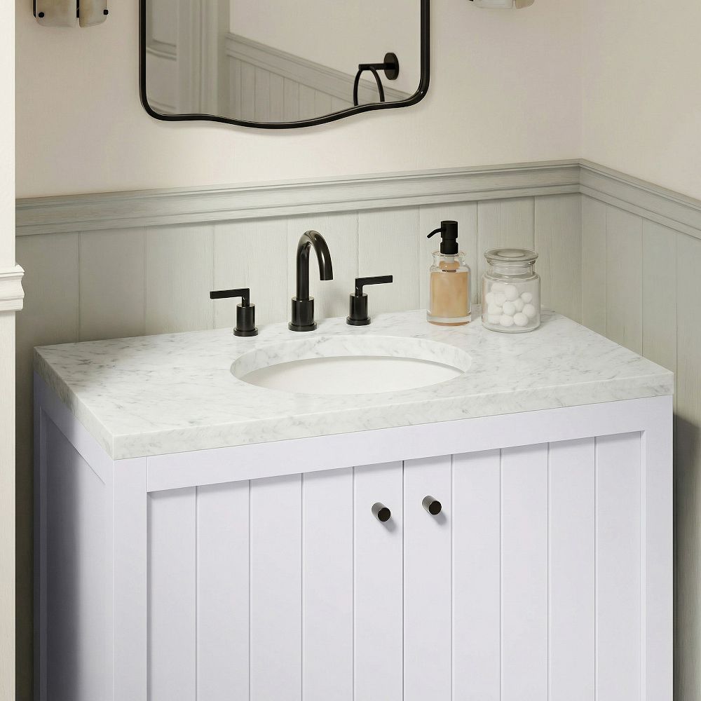 Vanity countertop with sink and faucet close-up