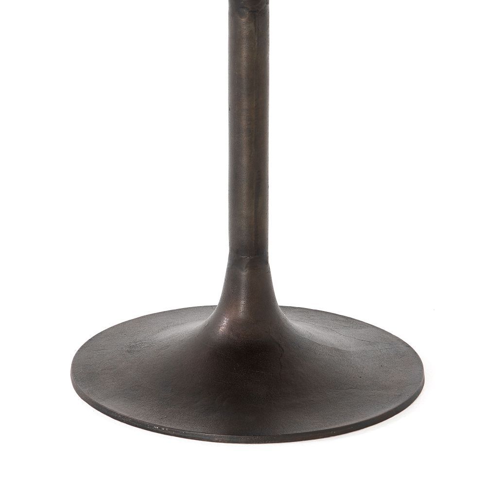 Dark metal pedestal base.
